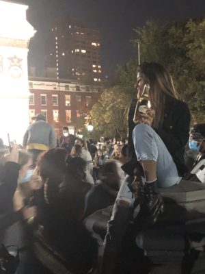 Revelers party under the light of the arch, with nary a policeman in sight. Image courtesy of Daisy Prince