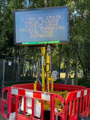 A sign warned Queue-goers to anticipate long waits and asked for patience. Image courtesy Simon Conway.