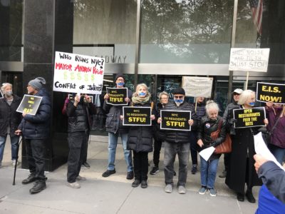 CUEUP supporters protested a closed-door Council session that was expected to approve making sheds permanent with signage including a succinct: “NYC to Residents: STFU.” (The session was ultimately postponed.) Photo courtesy of Peter S. Green