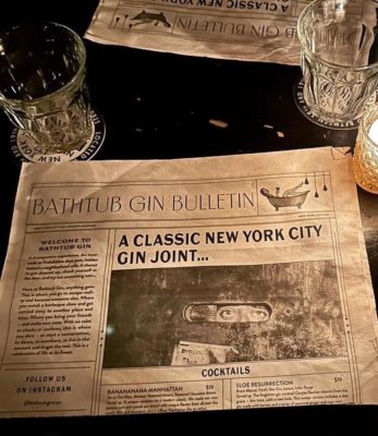 Bathtub Gin's cocktail menu comes in the form of a newspaper blaring headlines like “A Classic New York City Gin Joint