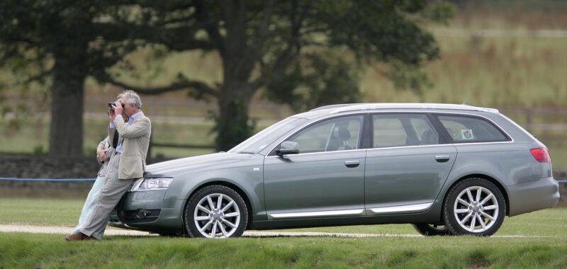 Leaning on his Audi Allroad watching Princes William and Harry play in The Chakravarty Cup polo match in 2009. Photo by Indigo/Getty Images