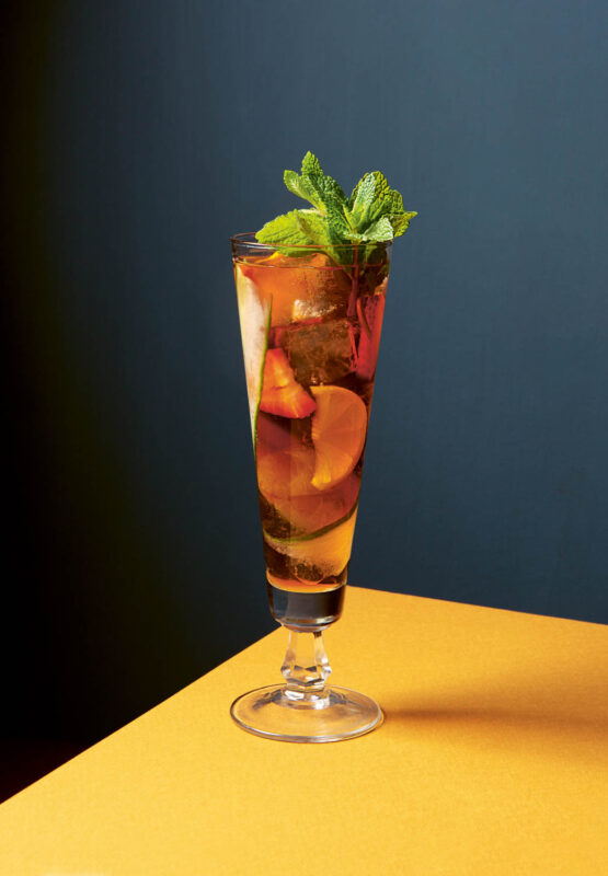 Pimm’s Cup cocktail garnished with a sprig of mint